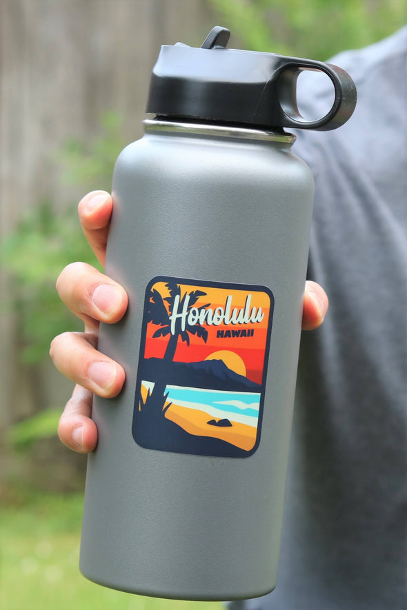 Honolulu Hawaii sticker on gray water bottle
