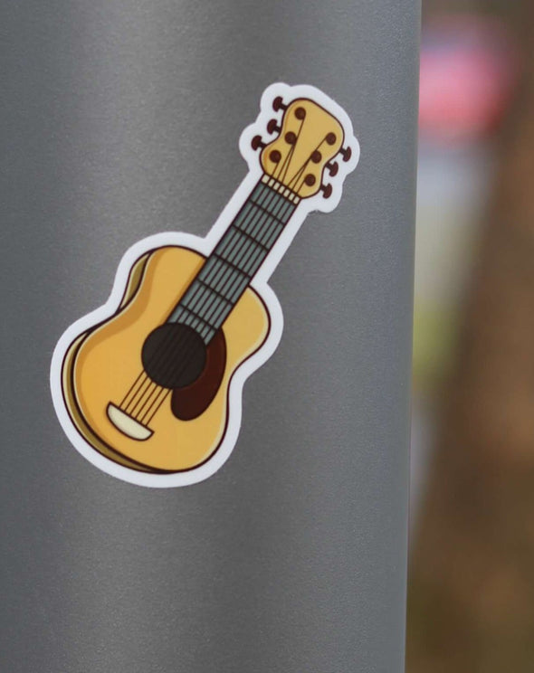 close up of vinyl acoustic guitar sticker on gray water bottle