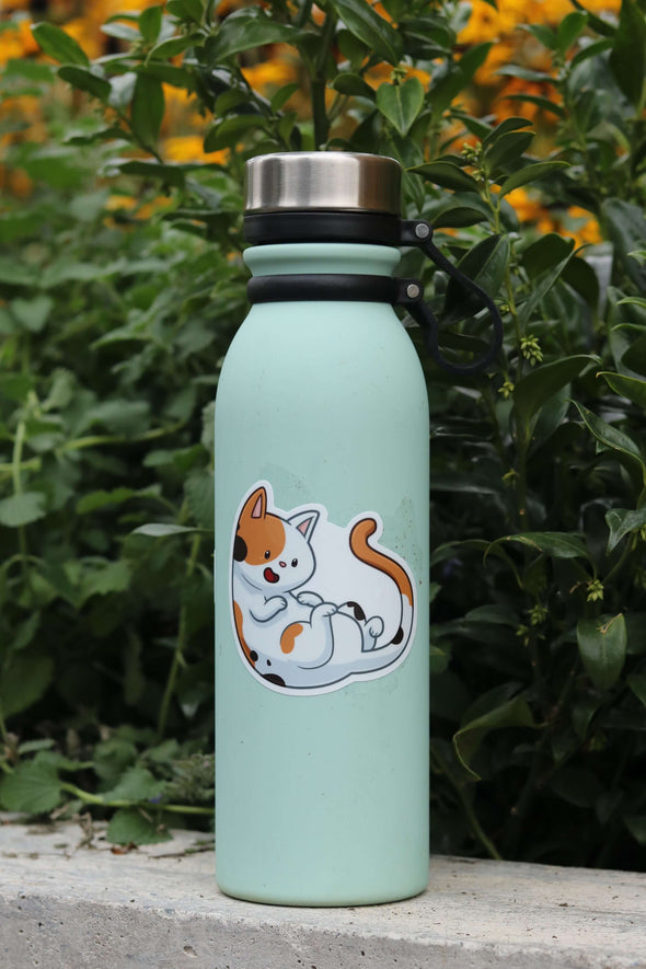 calico cat sticker on green water bottle