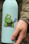 Cyclops sitting on rock Sticker on green bottle